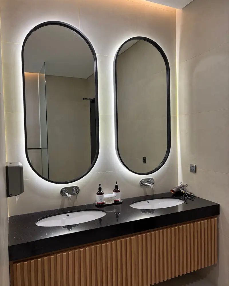 Backlit pill mirrors in the bathroom